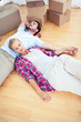 Couple relaxing together on the wooden floor