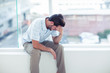 Stressful man holding his head 