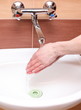 Washing of hands under running water
