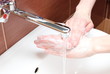 Washing of hands under running water