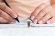 Young female is writing notes