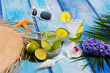 Photo: Cuban Mojito cocktail in tropical blue wood flowers and starfish Cuban Mojito cocktail in tropical blue wood flowers and starfish