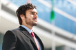 Photo: Handsome young businessman in an urban setting Handsome young businessman in an urban setting