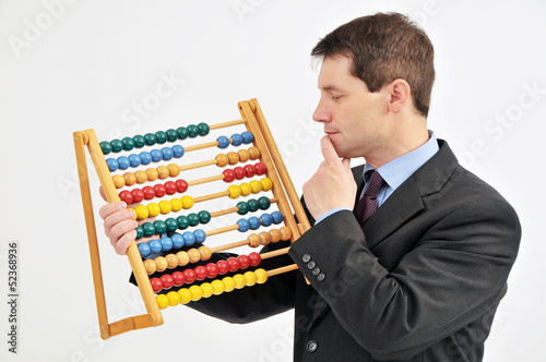 Photo: Businessman with abacus. Businessman with abacus.