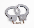 A pair of handcuffs isolated over white with clipping path