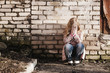 girl on background brick wall