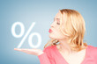 woman showing sign of percent in her hand
