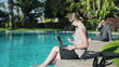 Video: Businesswoman relaxing by the poolside after work Businesswoman relaxing by the poolside after work