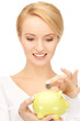 woman with small piggy bank and coin