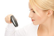 Photo: female scientist working with magnifier female scientist working with magnifier