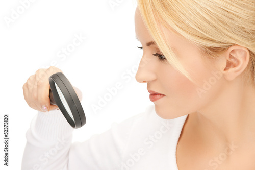 Photo: female scientist working with magnifier female scientist working with magnifier