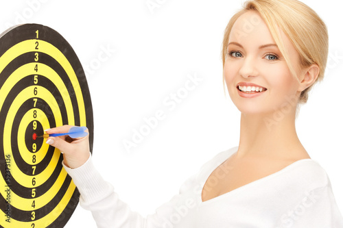 Photo: businesswoman with dart and target businesswoman with dart and target