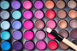 Colorful eye shadows palette with professional makeup brush. Mak
