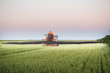 Tractor spraying on the field