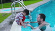Video: Father talking with his son in the swimming-pool Father talking with his son in the swimming-pool