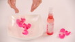 Video: Throwing flower petals into a bowl of water. Close-up Throwing flower petals into a bowl of water. Close-up