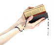 Hands holding the Bible and praying with a rosary