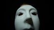 Masked man over black background