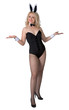 Young woman in sexy bunny suit on white background