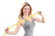 Happy woman stretching a measure tape