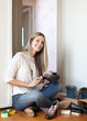 Woman cleans shoes