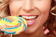 young happy woman with lollipop