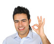 A smiling man showing thumb up sign