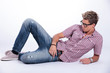 casual man relaxes on floor