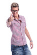 casual man showing thumb up