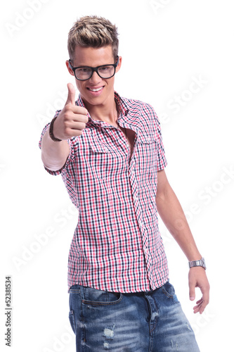 Photo: casual man showing thumb up casual man showing thumb up