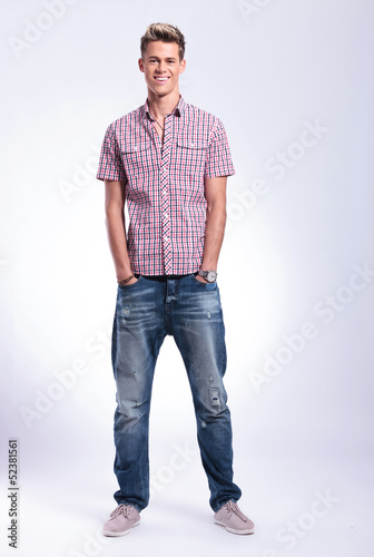 Photo: casual man with hands in pockets casual man with hands in pockets