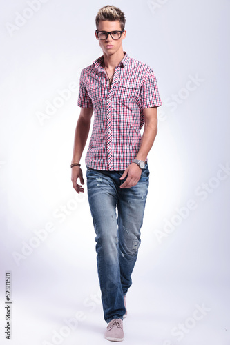 Photo: casual man walks forward casual man walks forward