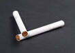 Two cigarettes on black background