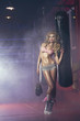 Foto: Sexy blonde woman posing in boxing hall Sexy blonde woman posing in boxing hall