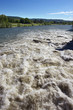 Brown River Rapids and Blue Sky