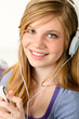 Portrait of a teenage girl listening music