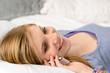 Lying teenager girl talking on her phone