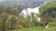 spring woman sitting by river