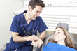 Dentist showing a client something about dental treatament