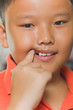 Photo: Young asian boy just losing his milk tooth Young asian boy just losing his milk tooth