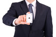 Businessman showing playing card.