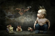 Baby boy around their toys looking at the image on the grunge wa