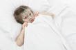 sick girl lying in bed