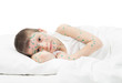 sick boy in white bed