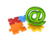 AT symbol and colorful puzzles.