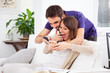Young couple looking a smartphone at home