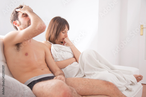 Photo: Young couple in the couch having conflict problem Young couple in the couch having conflict problem