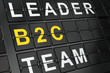 Business concept: B2c on airport board background