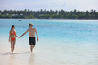 happy young couple have fun on beach
