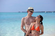 happy young couple have fun on beach